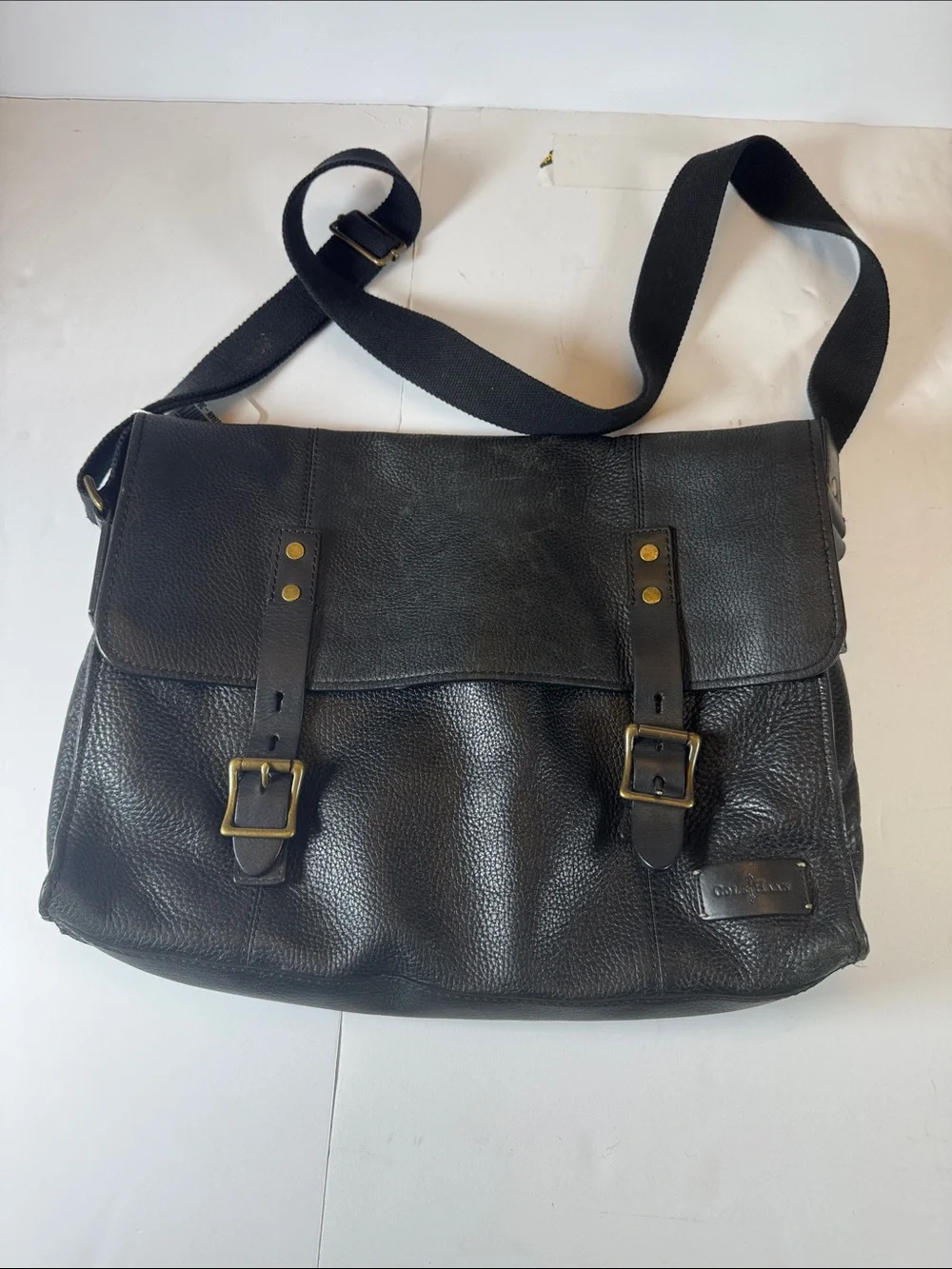 Cole Haan Black Leather Messenger Bag with Brass Accents